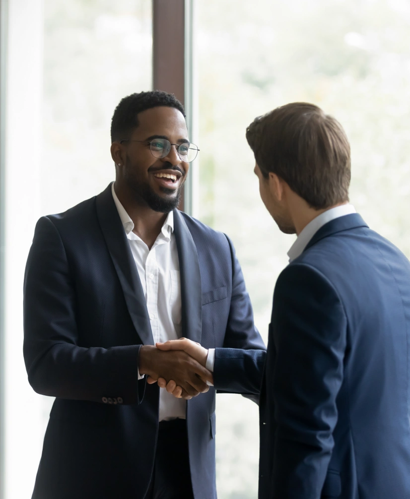 Corporate handshake between colleagues showcasing trust, teamwork, and positive business relationship in workplace