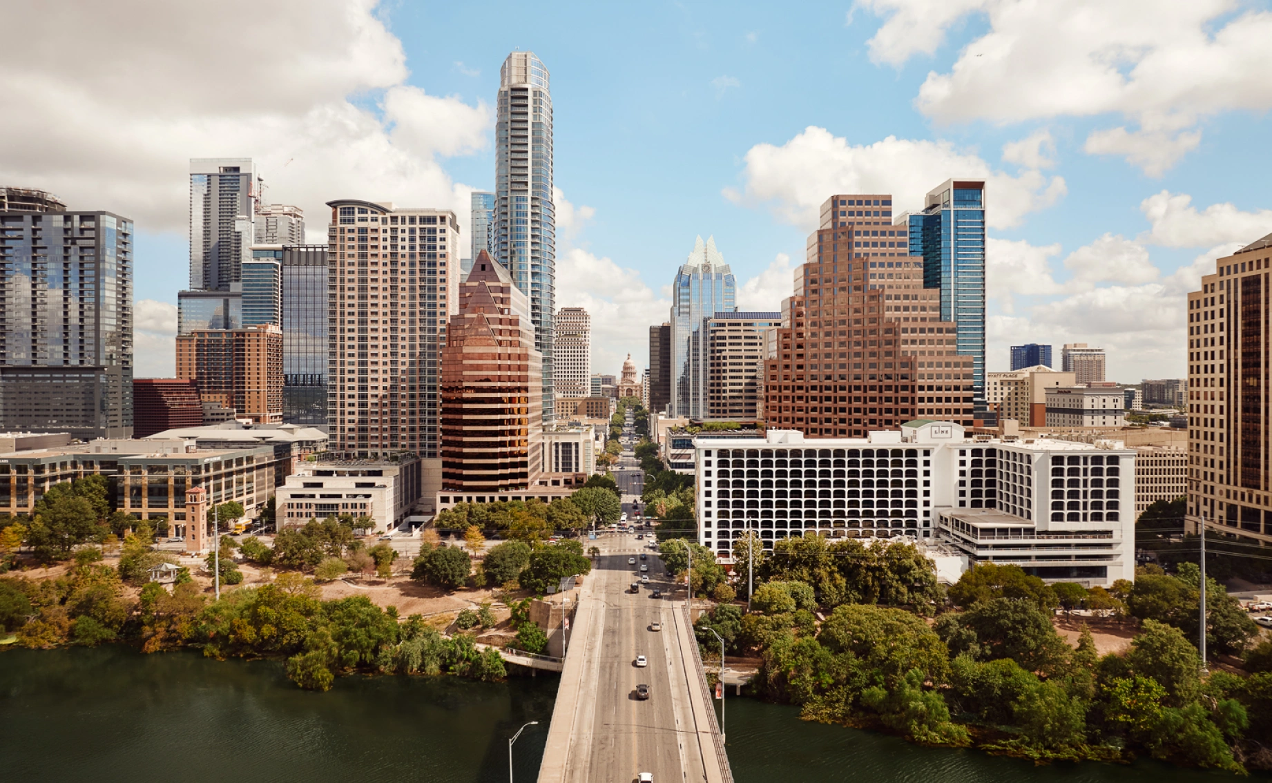 Professional commercial building set in an urban environment, emphasizing accessibility, greenery, and architectural balance