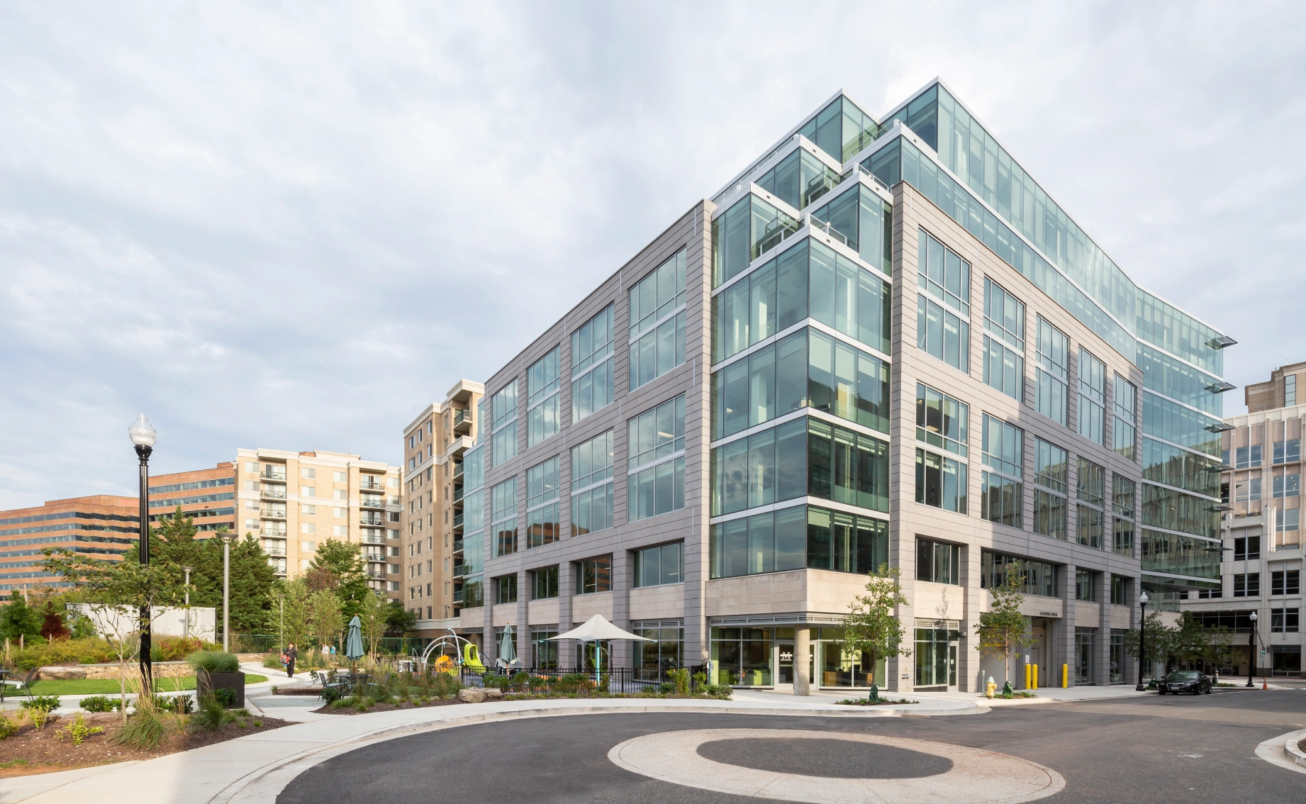 Contemporary commercial building designed with abundant natural light, outdoor amenities, and urban accessibility