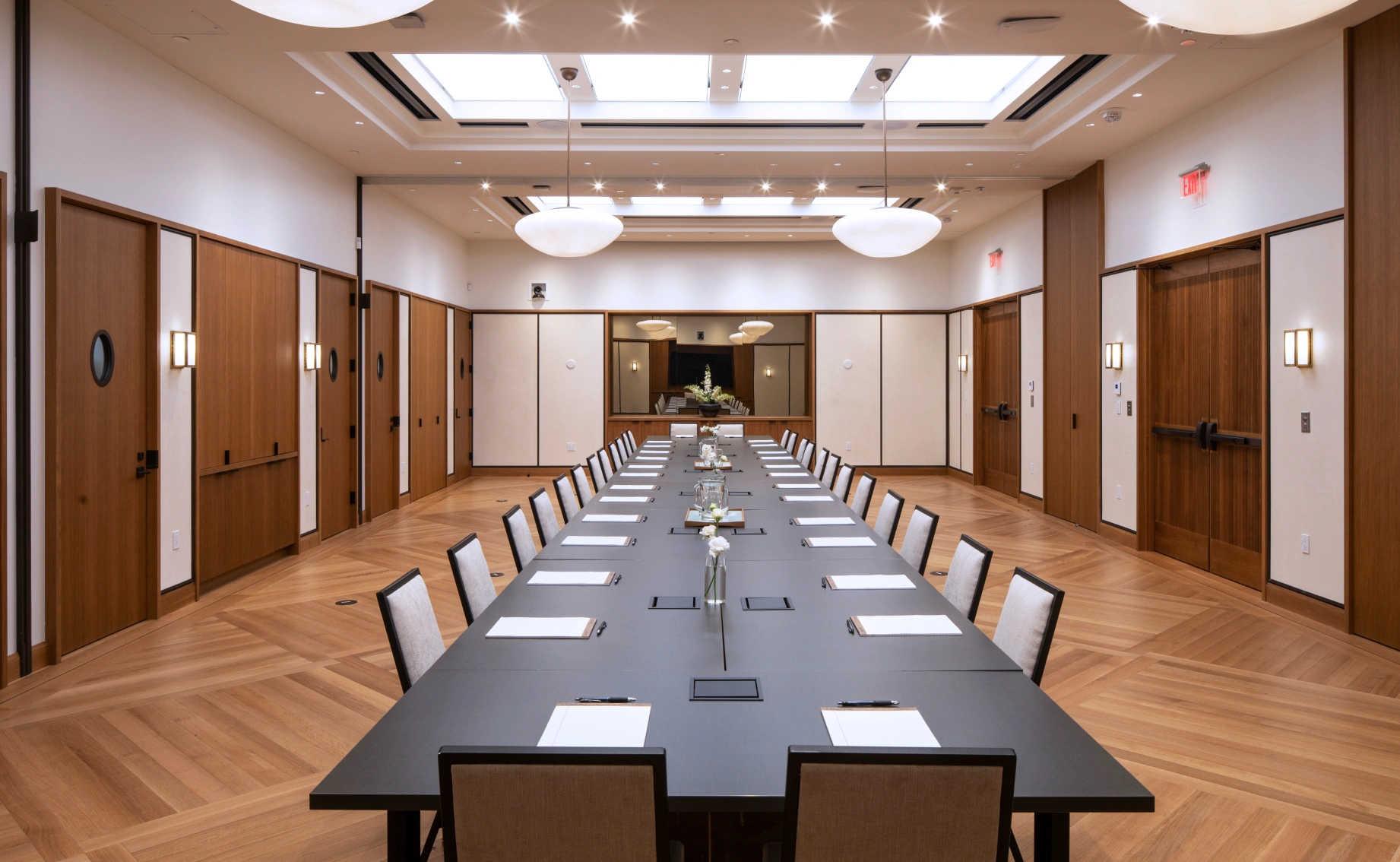 Contemporary meeting space designed for high-level collaboration, with integrated power, modern lighting, and acoustically balanced finishes