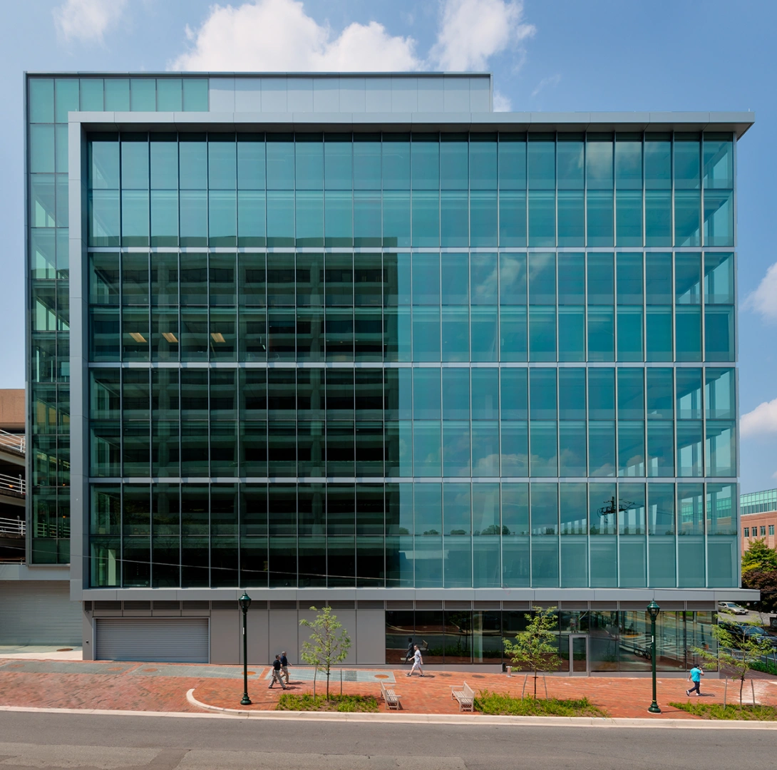Contemporary corporate headquarters exterior featuring large reflective windows and minimalist architecture