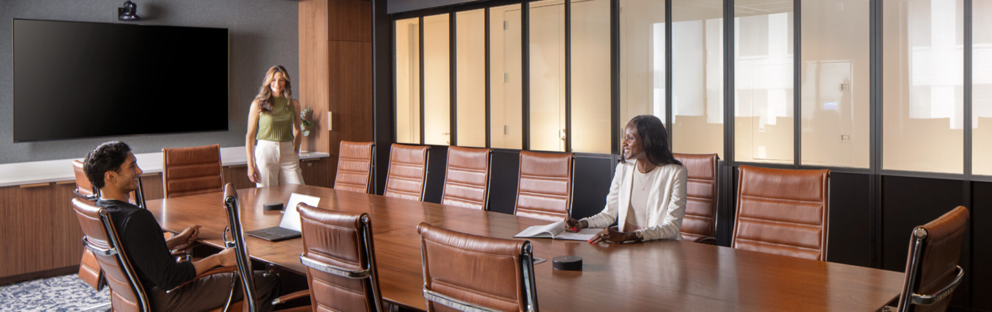 Business team collaborating during conference room meeting in contemporary office environment