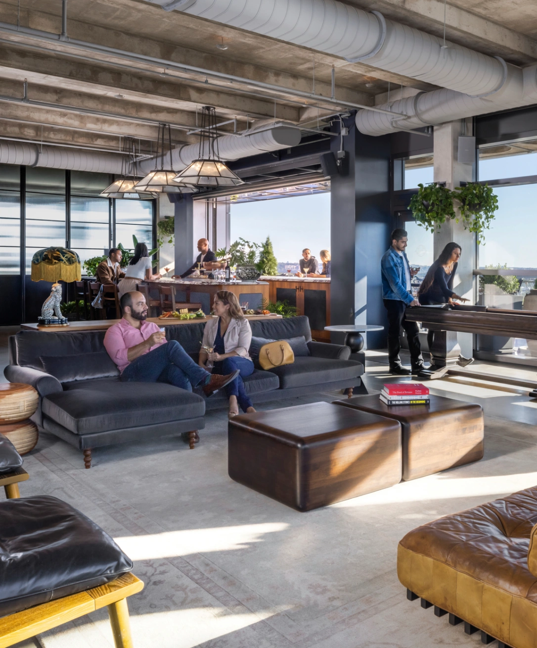 Stylish indoor social space featuring casual conversations, pool table, and upscale urban design